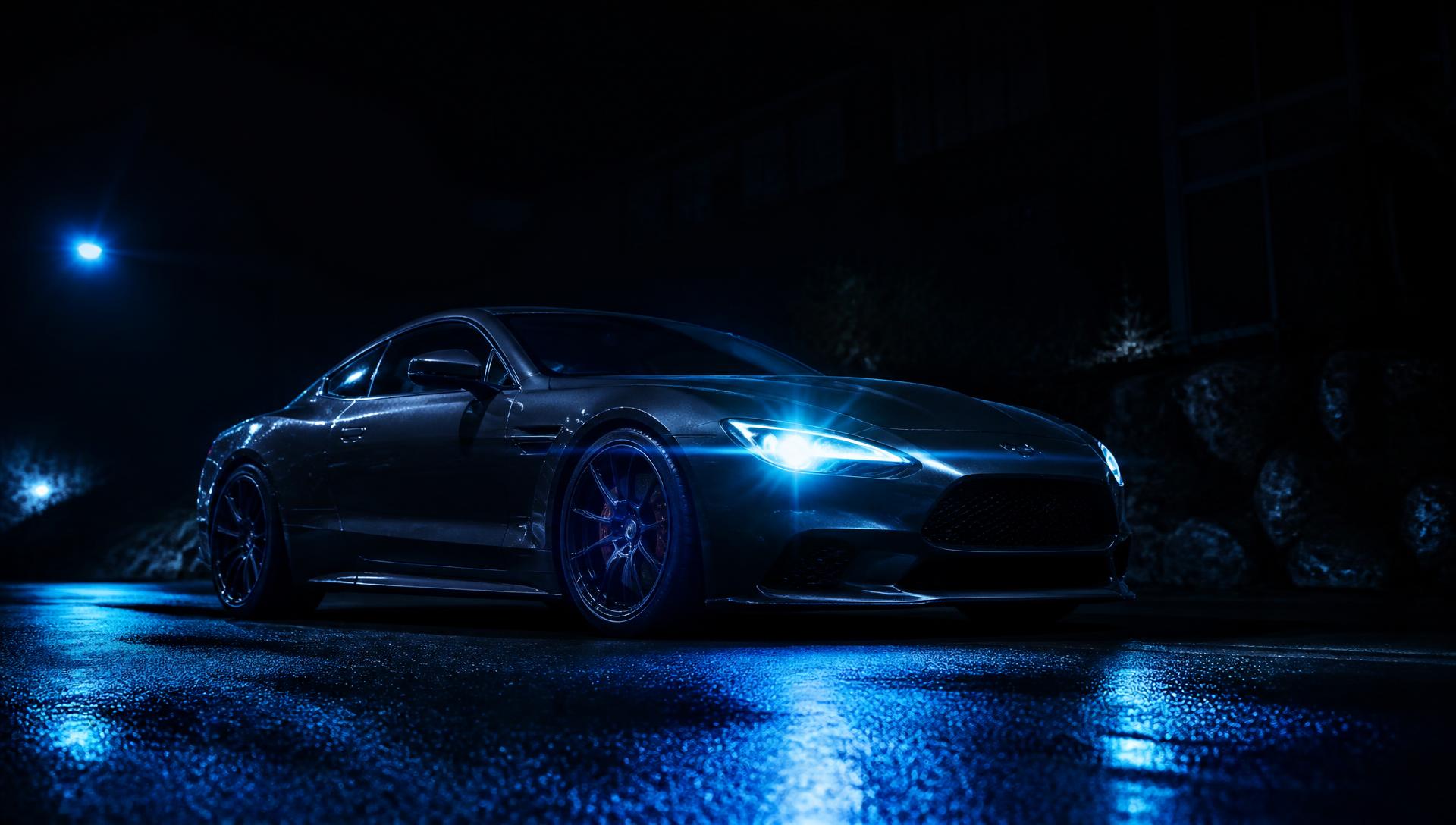 Modern car parked on a wet street at night, headlights on, waiting for a mobile locksmith in Palm Bay, Florida